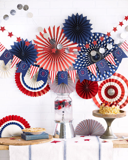 red, white, and blue banners, bunting, and paper fans for American holiday celebrations