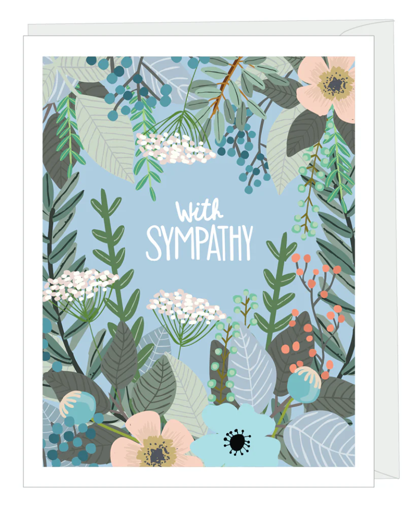 Greeting card with white text that read "with sympathy" surrounded by a variety of illustrated plants and flowers, paired with a white envelope