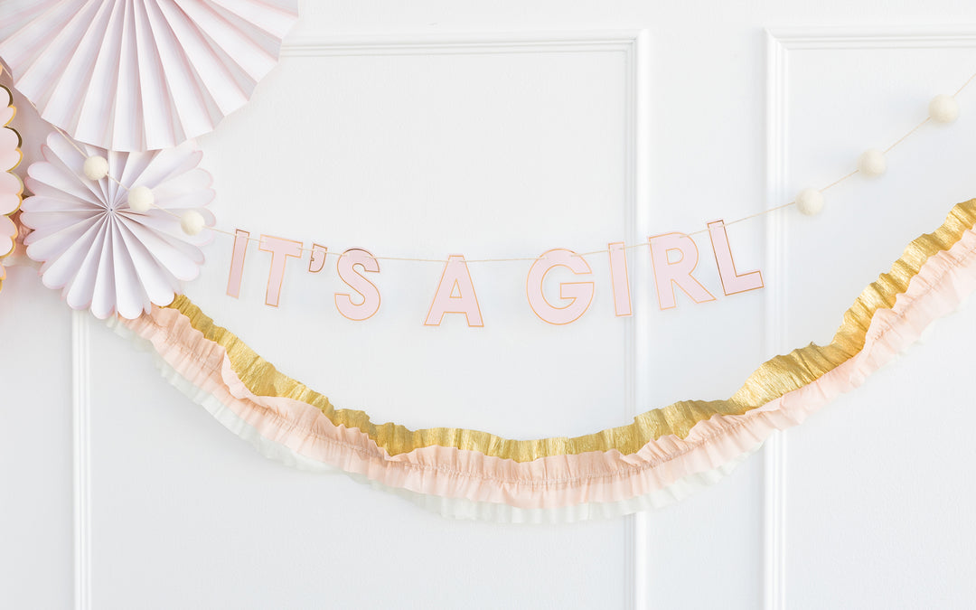 Pink and gold outlined banner that reads It&