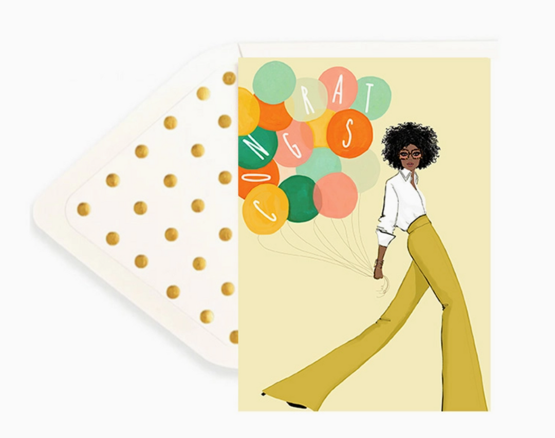 A yellow greeting card with an illustration of a Black woman in a yellow pants and a white shirt holding colorful balloons with the word &