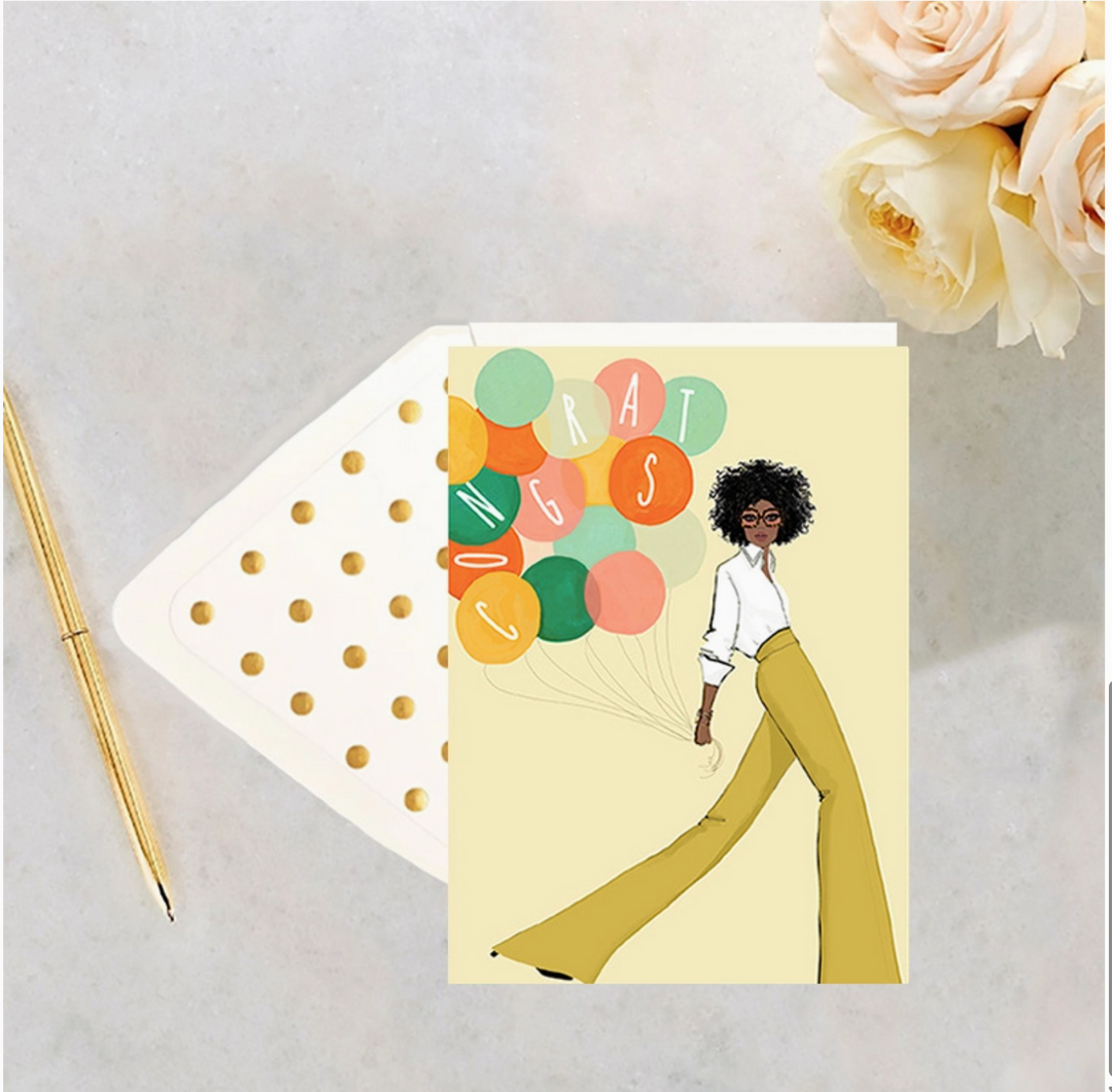 A yellow greeting card with an illustration of a Black woman in a yellow pants and a white shirt holding colorful balloons with the word &