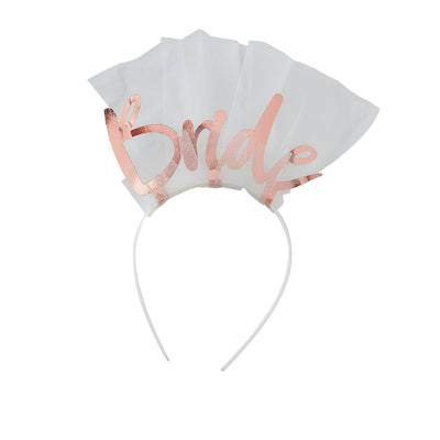 White headband wrapped in white tulle with bride in rose gold individual letters on top