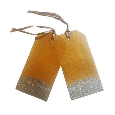 A set of 2 Kraft paper gift tags with pocket on backside dipped in silver glitter