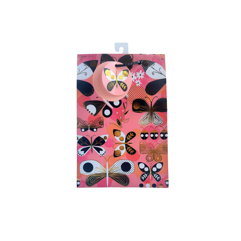 Pink background, pinks, black, white, and gold foil butterfly and ladybug printed gift bag