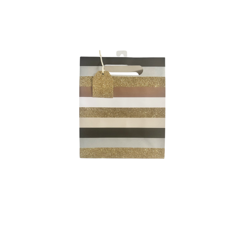 Black, white, glitter gold, bronze, and silver striped gift bag with glitter gold gift tag attached