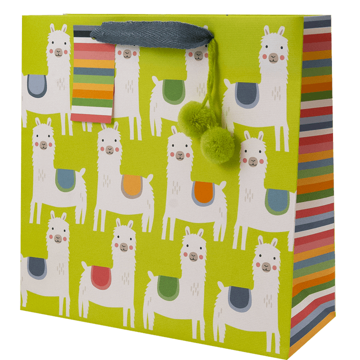 allover llama print with colorful saddles on a lime green gift bag, lime green pom-poms accent, a multi-color stripe side panels and gift tag 