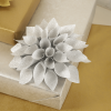 Glittery Silver lotus shaped Gift Bow on a gift box