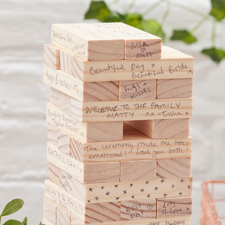 Stack of wooden blocks with personalized messages on a blurred background