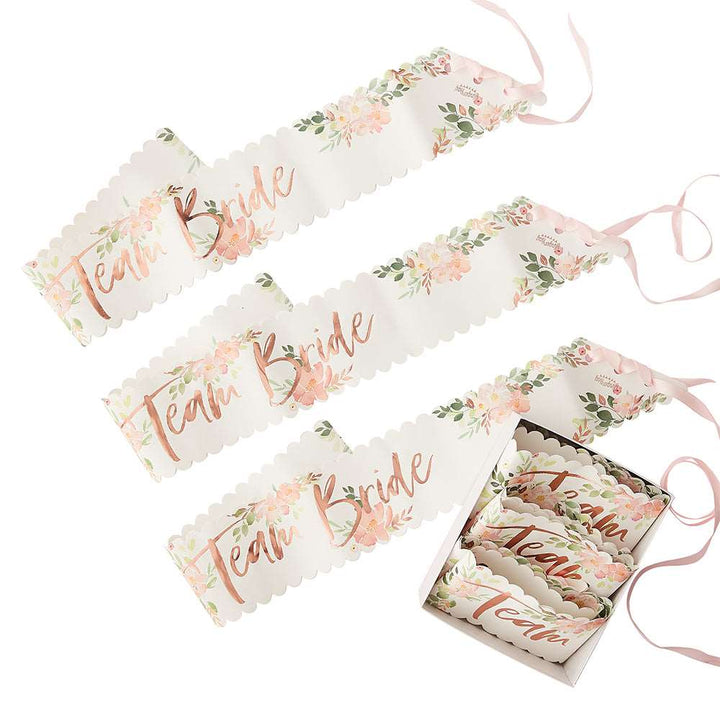 Three paper sashes with floral patterns and &