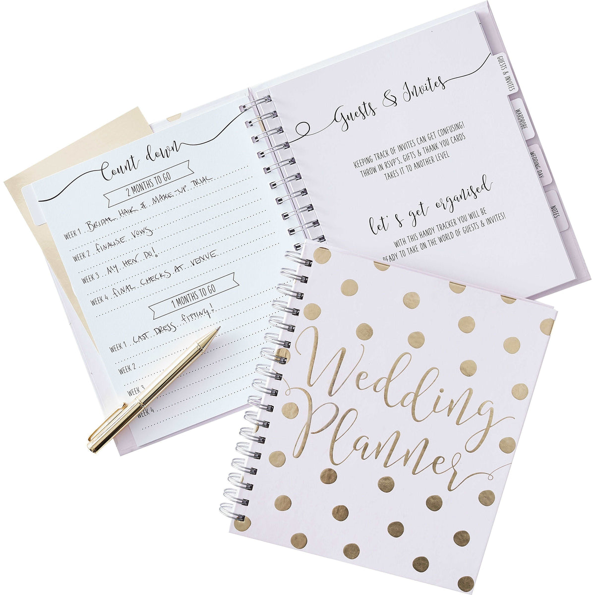 A pale lavender spiral notebook with gold foil polka dots and 'WEDDING PLANNER' text on the cover, along with a gold pen.