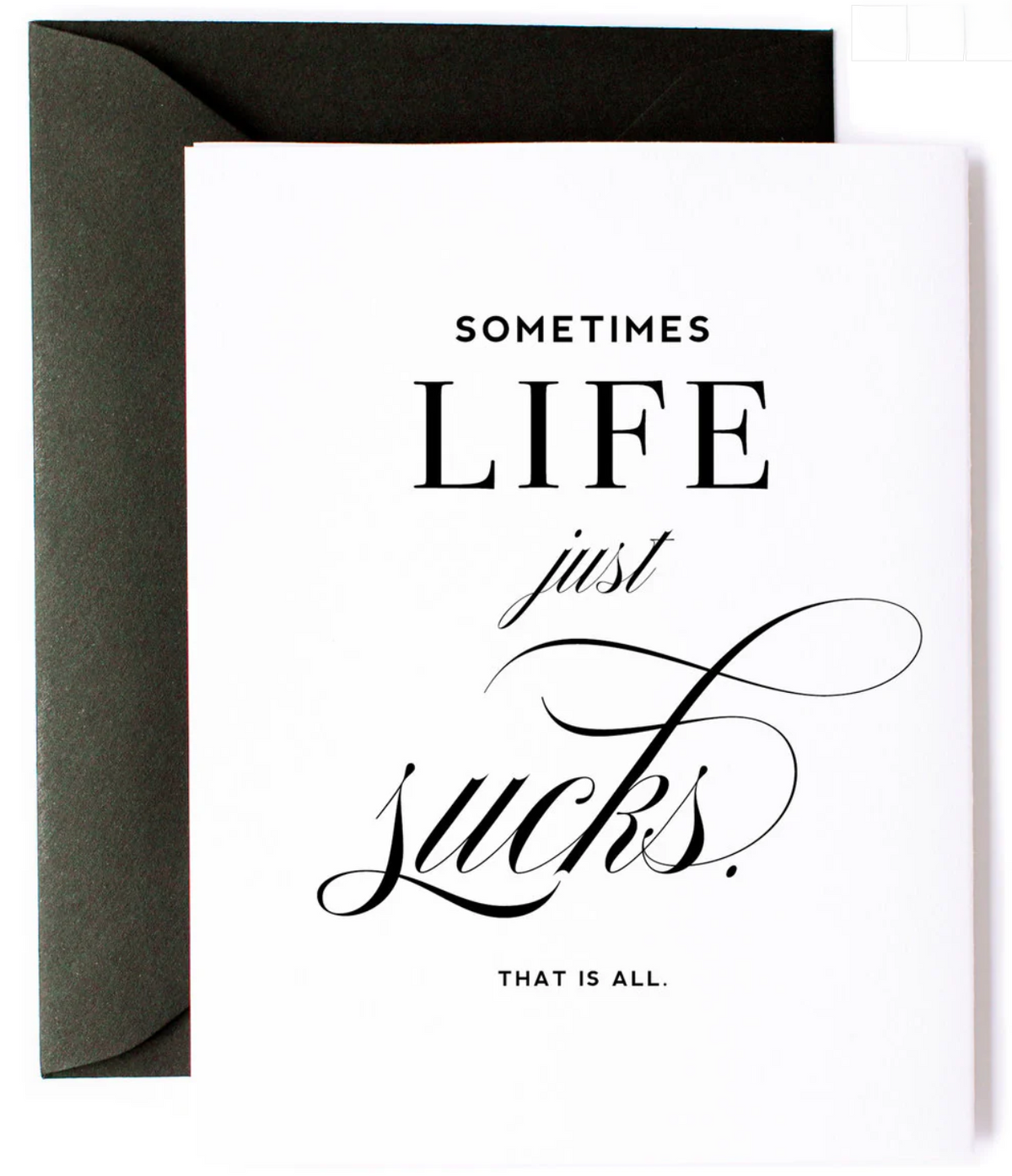 White greeting card with black text 'Sometimes life just sucks. That is all.' with a black envelope.