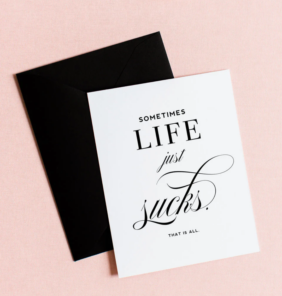 White greeting card with black text &