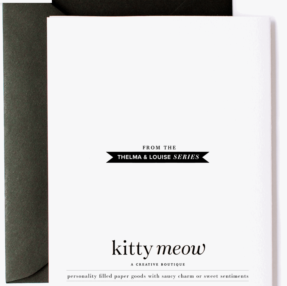 Backside of greeting card with the text "From the Thelma & Louise series, Kitty Meow a creative boutique, personality filled paper goods with witty charm or sweet sentiments. Designed and printed in the USA - kittymeowboutique.com - no. salty friend 03 with a black envelope