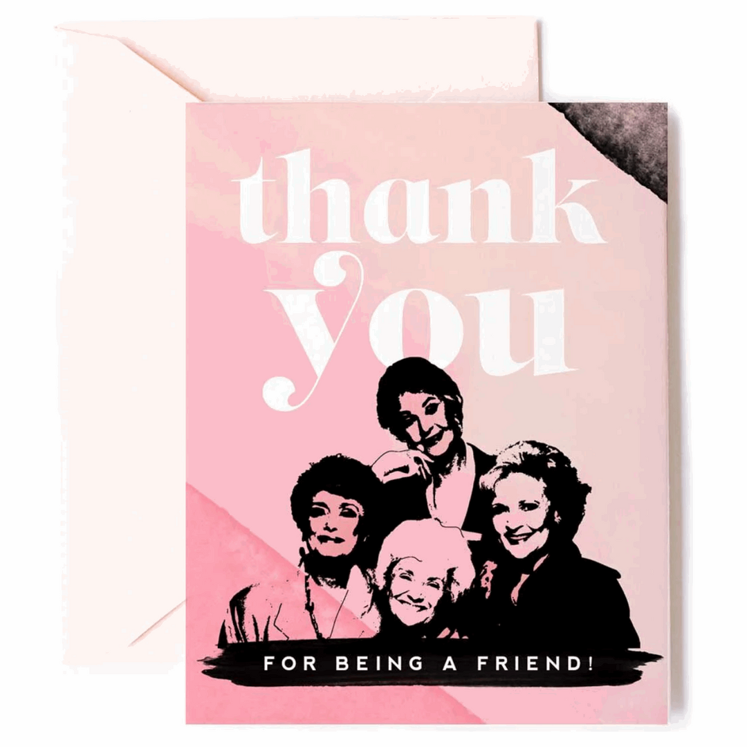 Pink greeting card featuring an illustration of the Golden Girls and text reading "Thank you for being a friend."Paired with a peach envelope