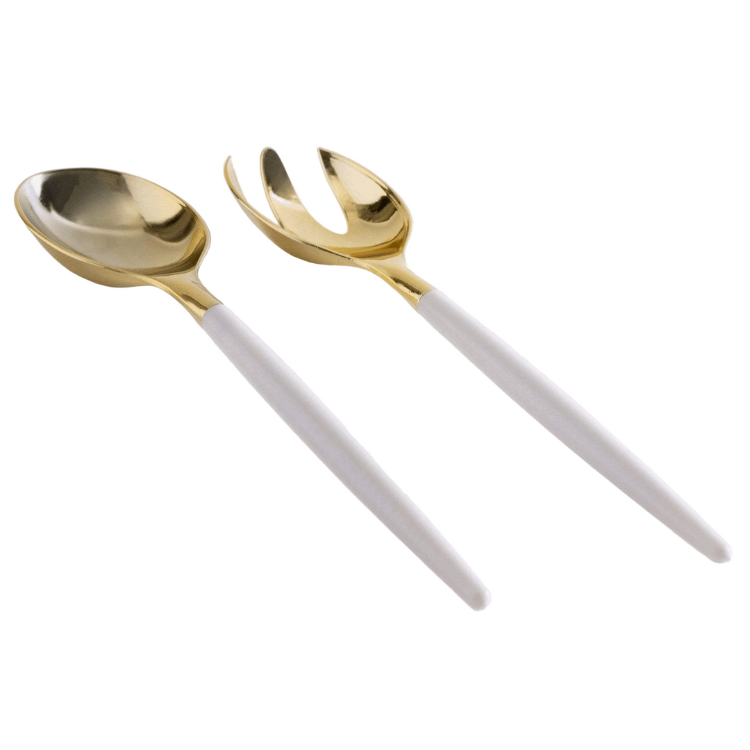 White background, side view of a white-handled salad serving set with gold tops. 1 salad serving fork next to 1 salad serving spoon.