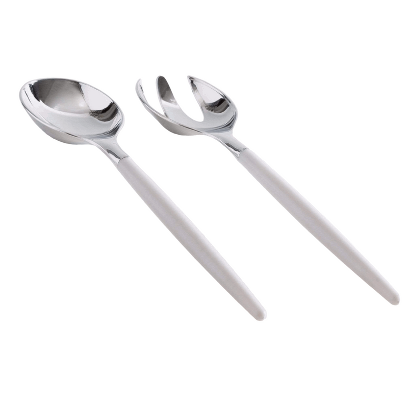White background, a side view of a white-handled salad serving set with silver tops lying down. 1 salad serving fork next to 1 salad serving spoon.