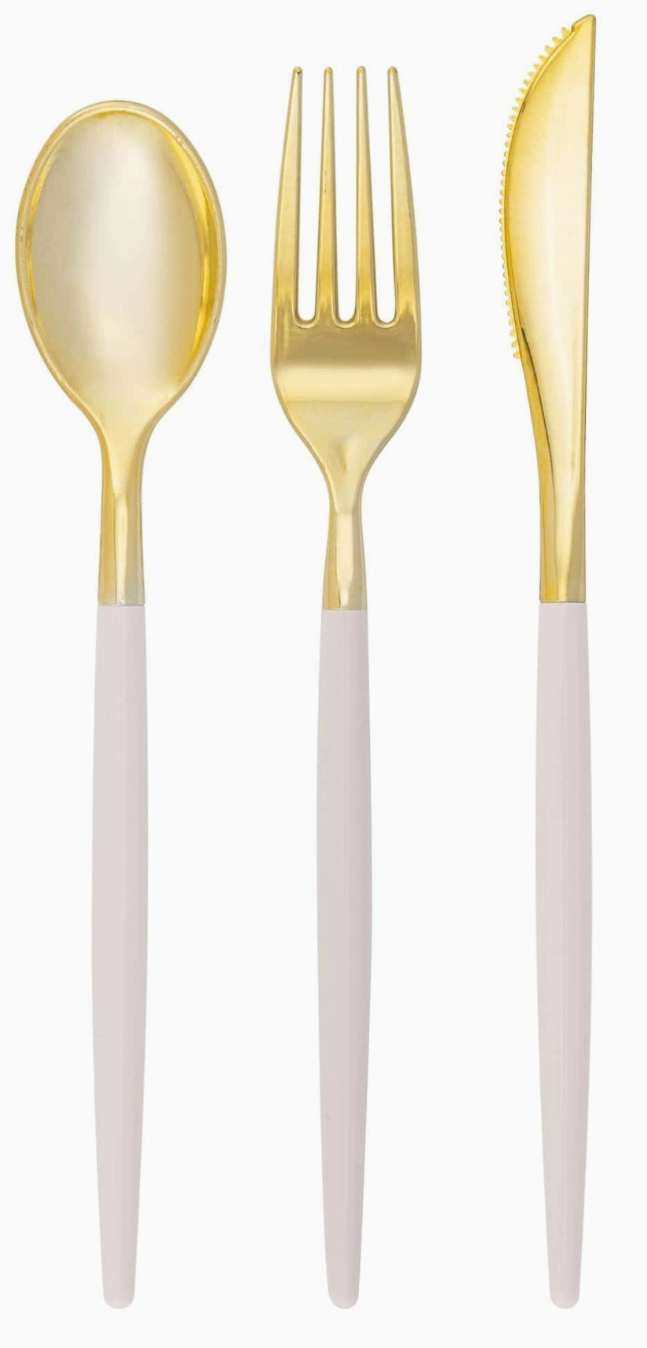 A set of two-tone utensils with linen (a light taupe) color handles with gold heads, including 1 fork, 1 spoon, and 1 knife.