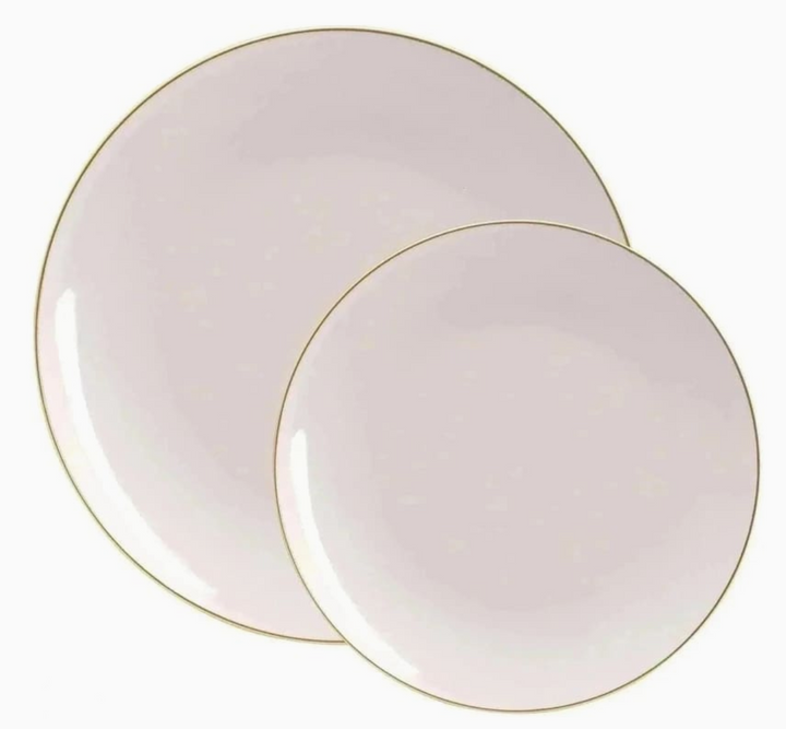 Two pinkish beige colored plates with gold rims on a white background