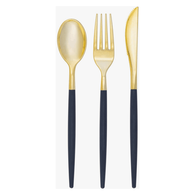 White background, Navy-handled and gold flatware set of 1 spoon, 1 fork, and 1 knife laid out next to each other.