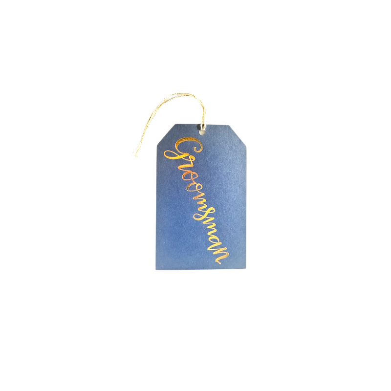 Navy blue textured gift tag with cream twine and gold foil printed  "Groomsman"