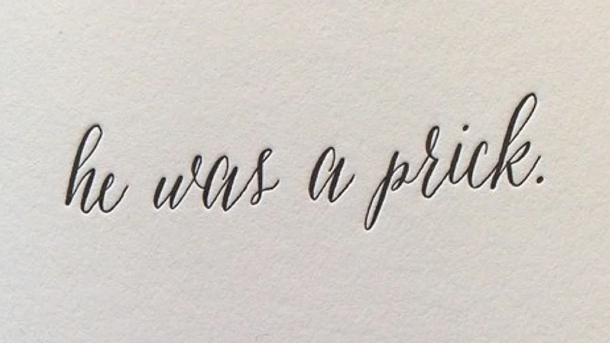 Black text "he was a prick." in black on a textured white paper as the background