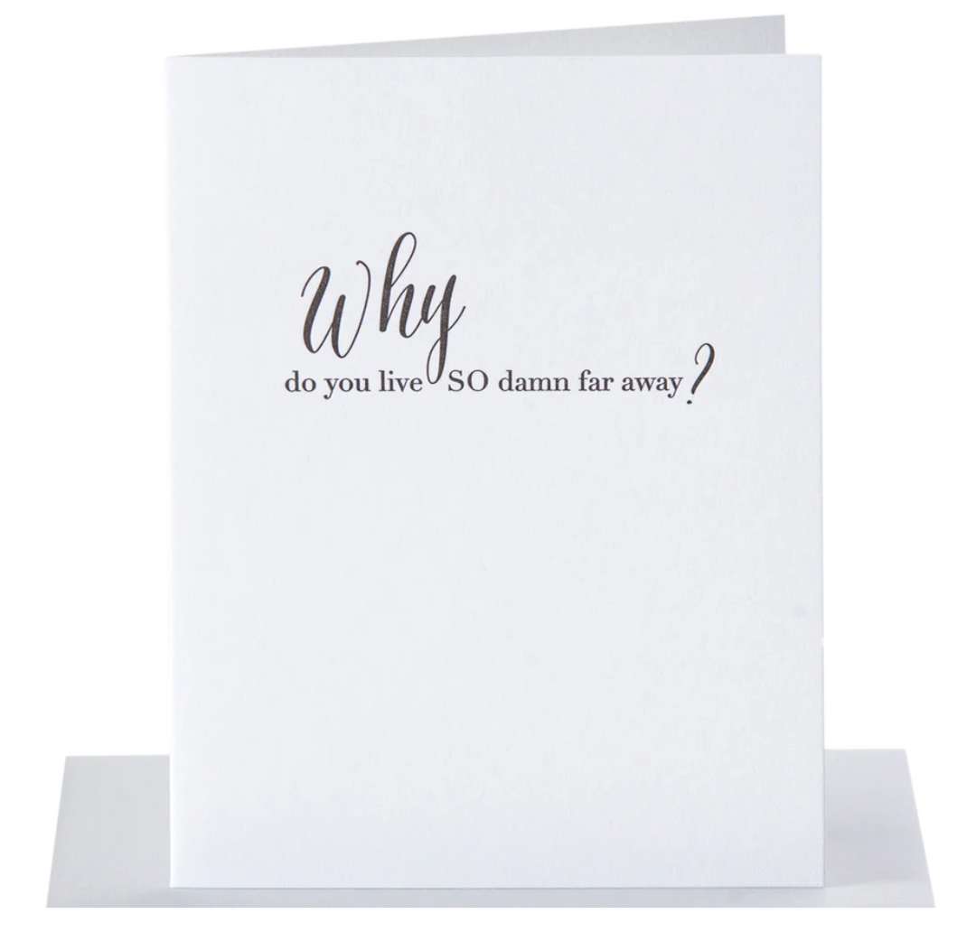 White greeting card with black text that reads why do you live so damn far away?" paired with a metalic silver envelope