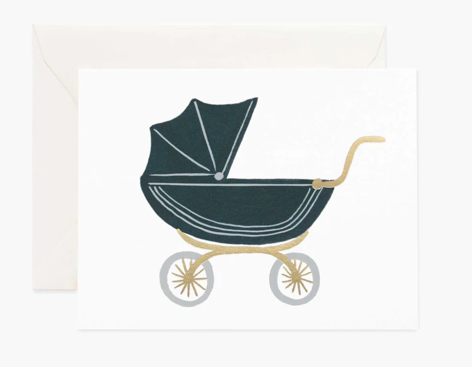Cream greeting card with an illustration of a vintage-style navy baby stroller with gold trim and silver wheels with a white envelope