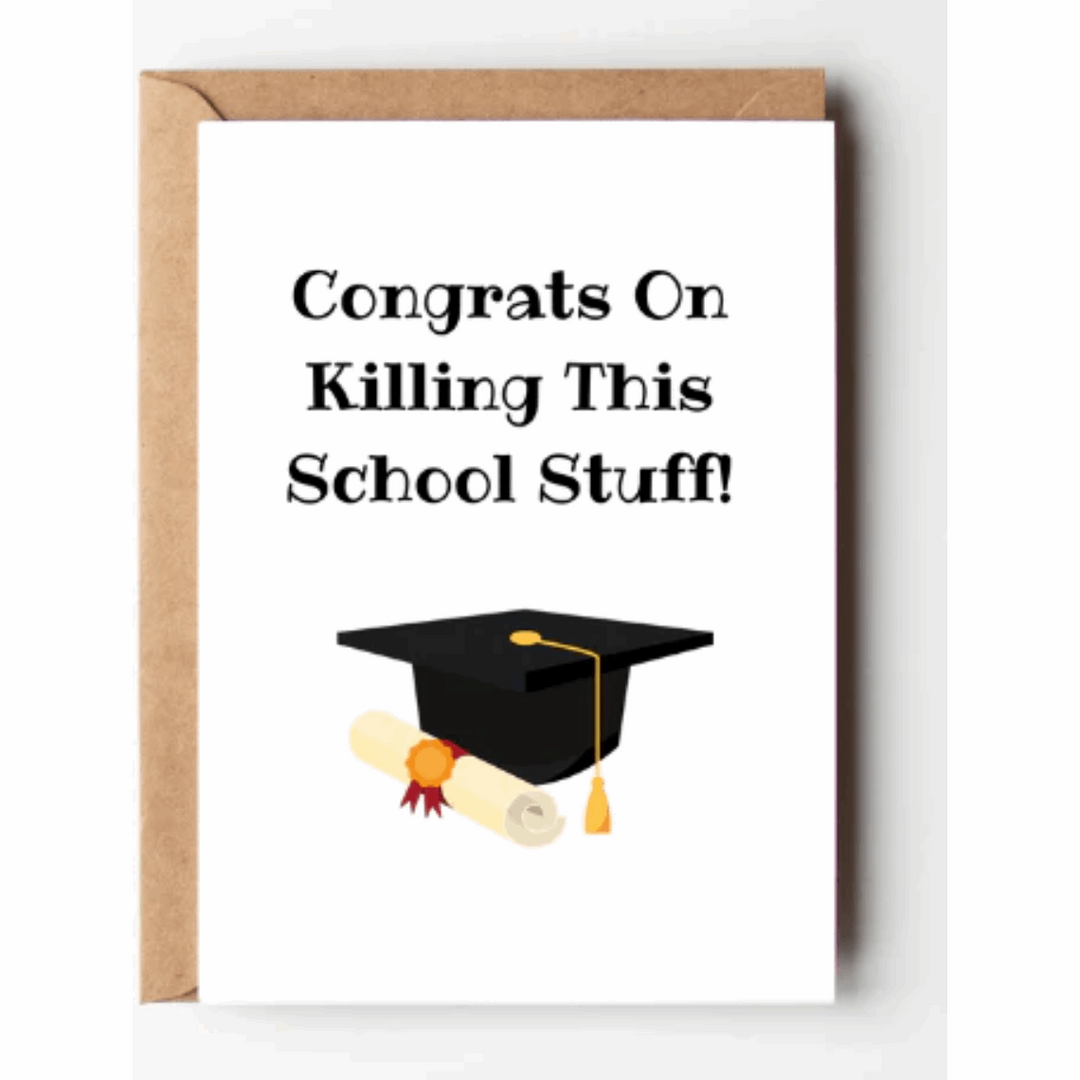 White greeting card with the words congrats on killing this school stuff and the illustration of a black graduate cap, gold tassel, and a rolled diploma and a kraft brown envelope