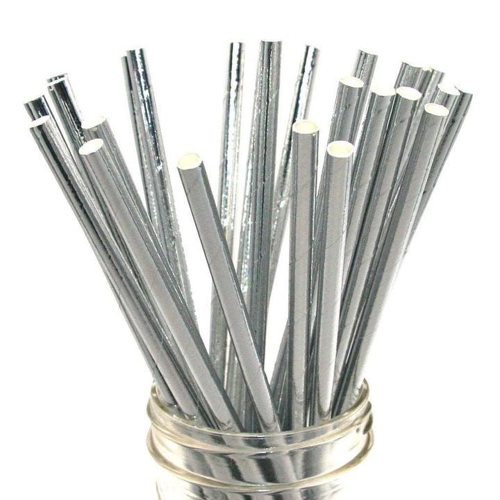 An image of silver foil paper straws in a glass mason style jar