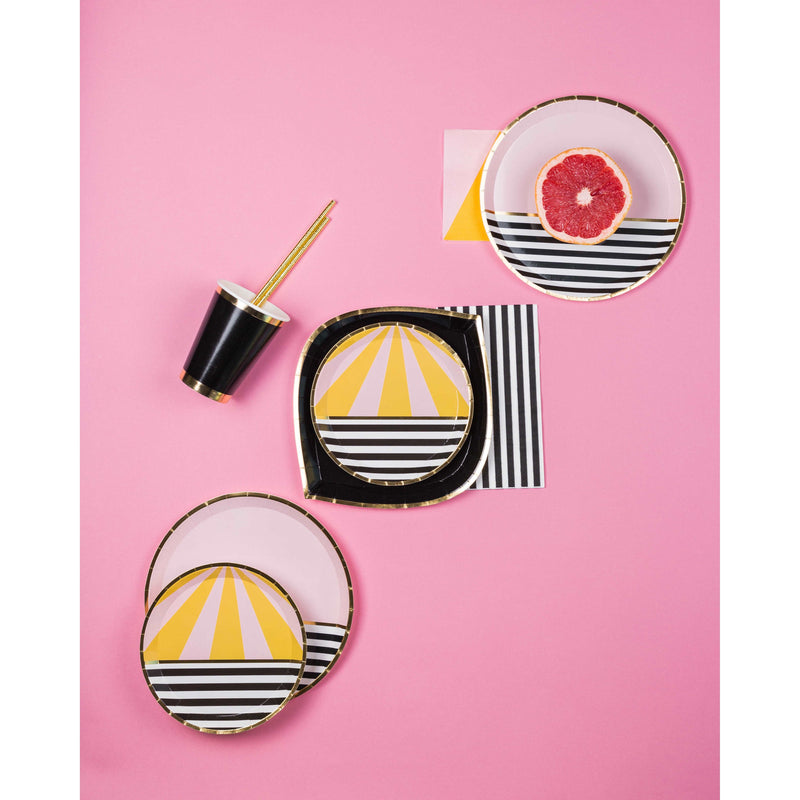 Pink, yellow, black and white retro printed plates and cups