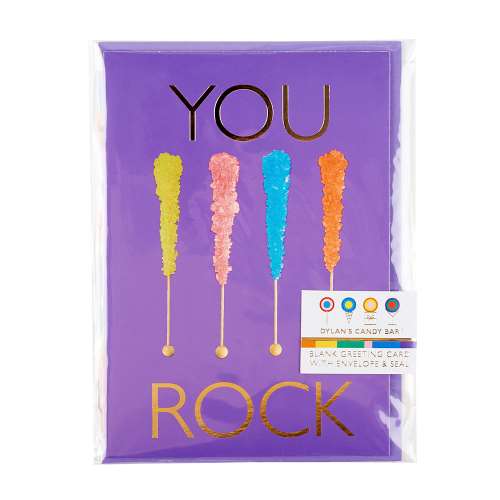Packaged vibrant purple greeting card, with a picture of 4 pop rock candies and text "You Rock" in gold foil