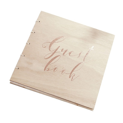 Wooden guest book with twine binding and a rose gold foil printed guest book on the front