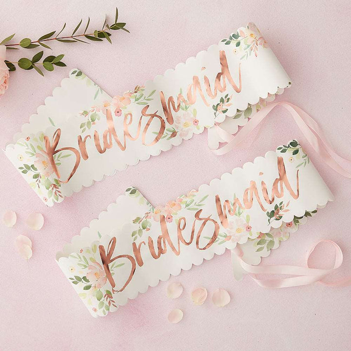 Two paper sashes with floral patterns and &