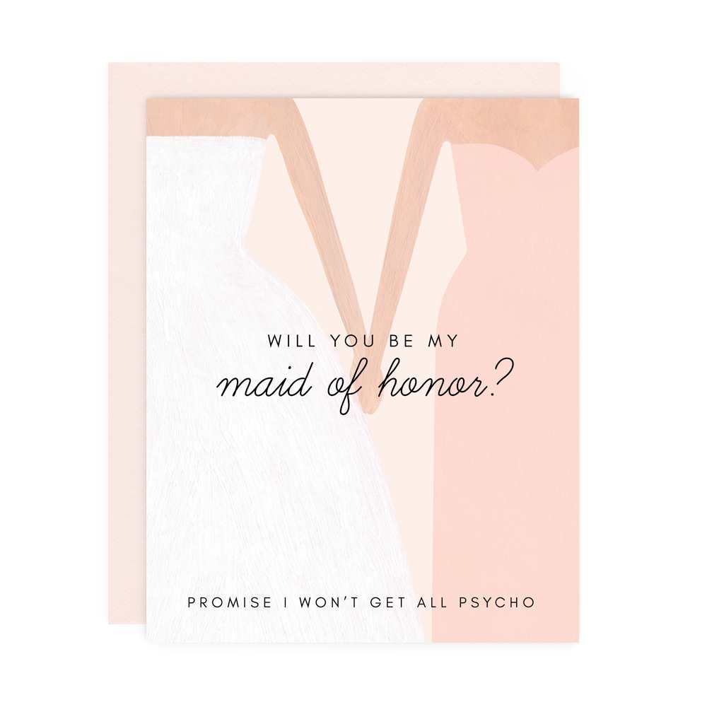 A greeting card featuring text that reads "Will you be my maid of honor? Promise I won't get all psycho" with an illustration of a person in a white gown holding the hand of a person in a pink dress with a pink envelope