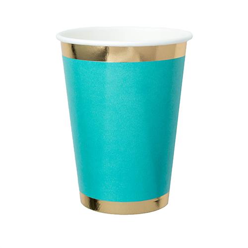 teal blue paper cup with gold foil borders against a white background