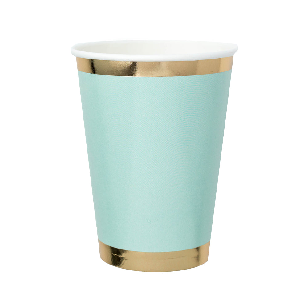 mint green paper cup with gold foil borders against a white background