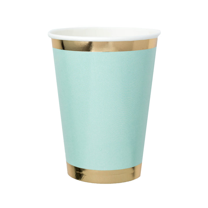mint green paper cup with gold foil borders against a white background