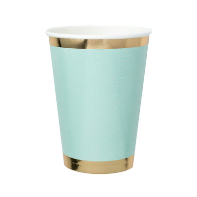 mint green paper cup with gold foil borders against a white background