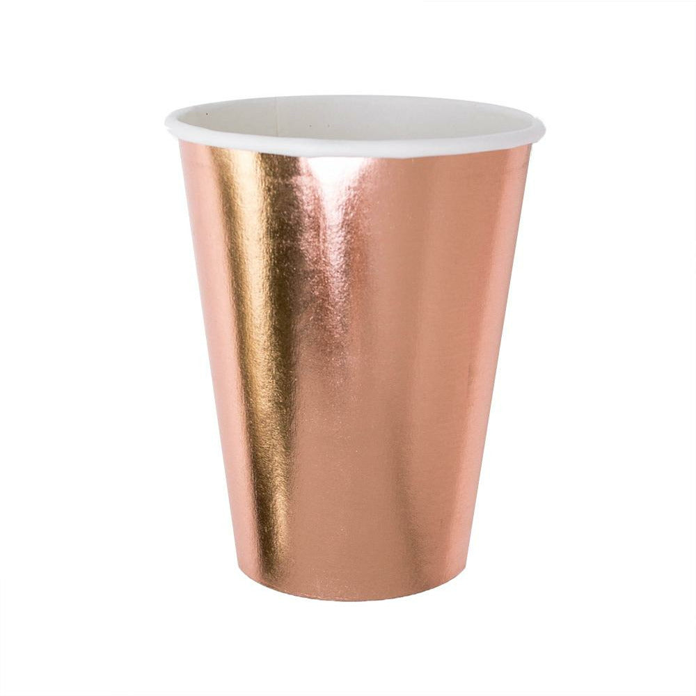 rose gold foil paper cup against a white background