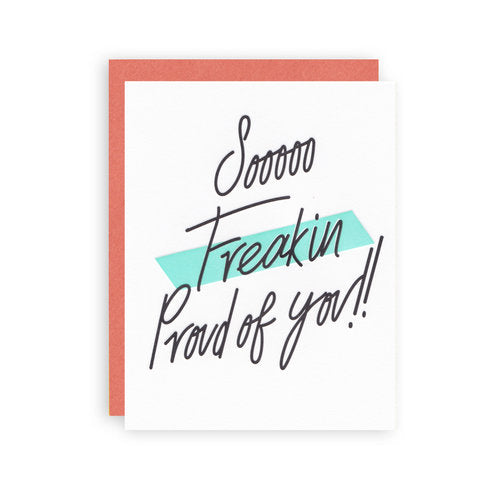 White greeting card with text that reads "Sooooo Freakin' Proud of you!!" with a red-orange envelope