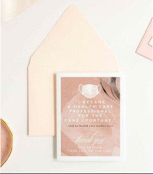 A greeting card with text and a mask graphic, an envelope on a light background