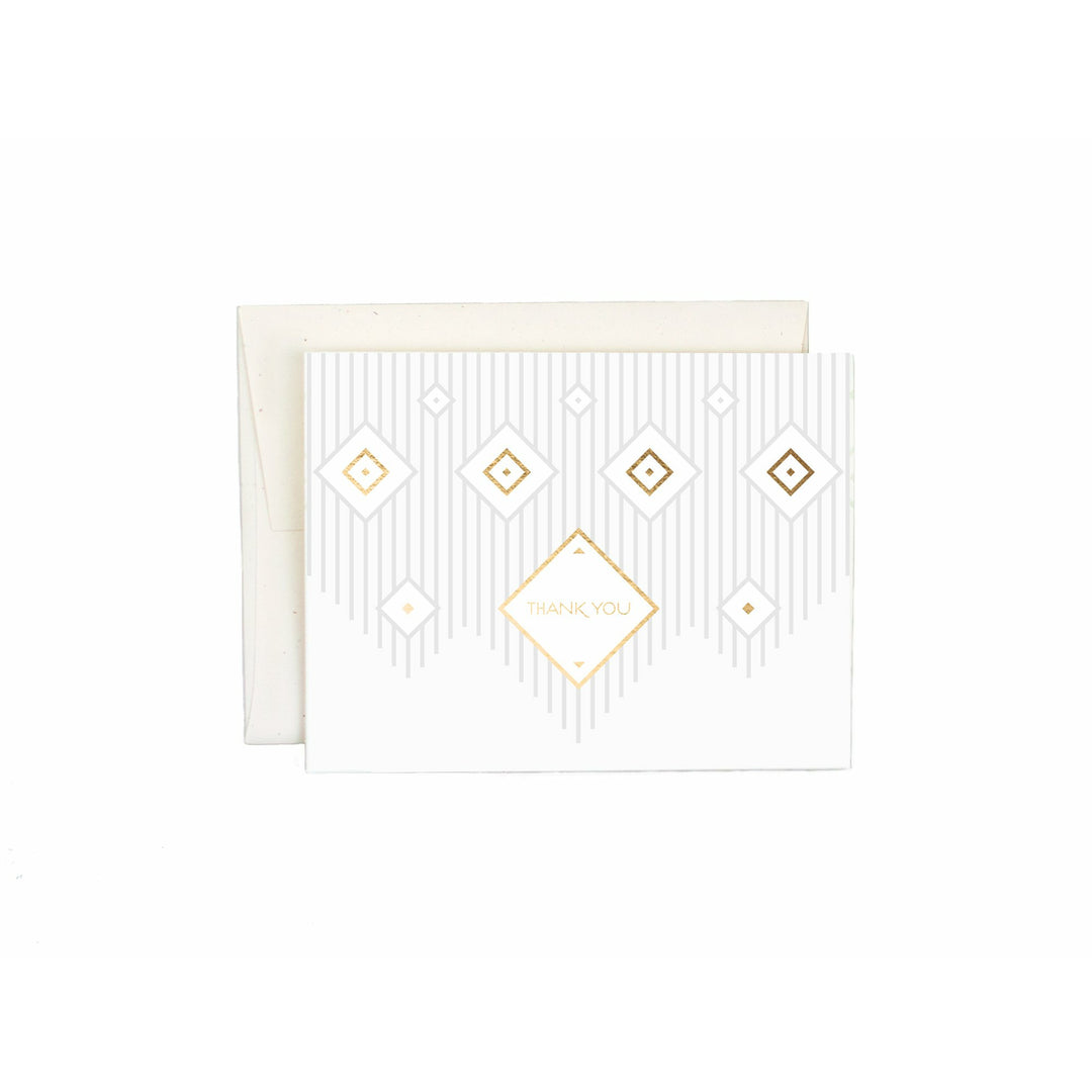 White greeting card with a macramé-inspired geometric design and text that reads "Thank you" with a white envelope