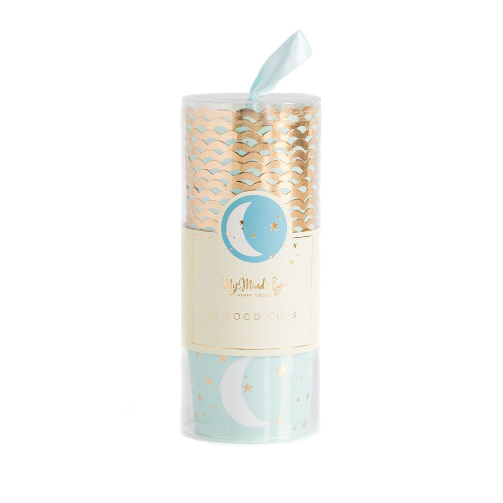 A package of paper baking cups. The cups are stacked in plastic tube with a light blue ribbon, light blue color with a white printed moon and all over gold stars