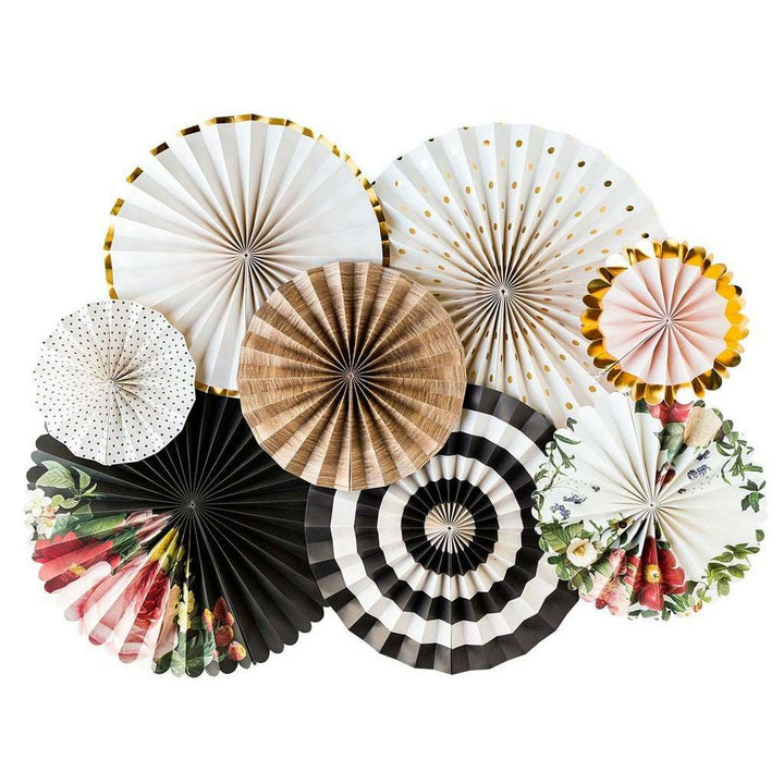 A collection of decorative paper fans with various patterns, including floral, polka dots, and stripes, in shades of white, gold, black, red, pink, yellow, and green.