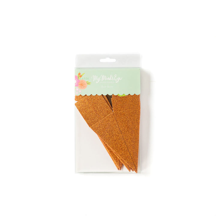 Package of glittery orange die-cut carrot-shaped favor box.