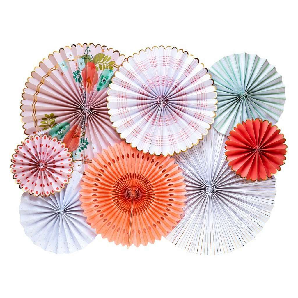 A collection of paper fans with floral, gingham, and striped patterns in pastel colors is displayed on a white wall.