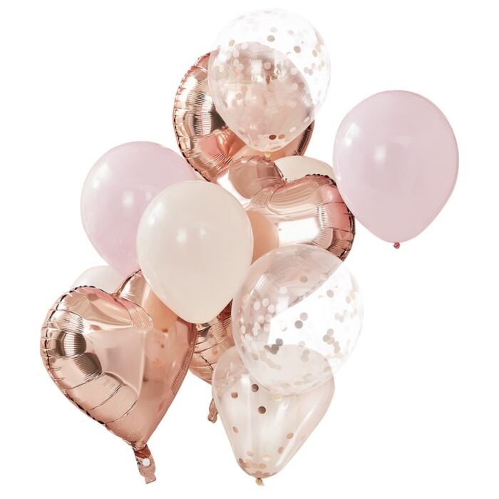 A collection of balloons in rose gold, blush, and peach colors, including round and heart-shaped foil and latex balloons.