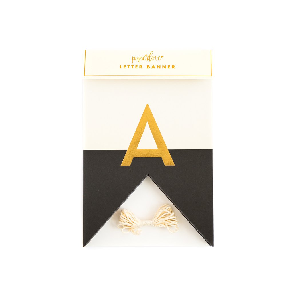 Package of a decorative letter banner in black and white flag style with gold foil letters and twine.