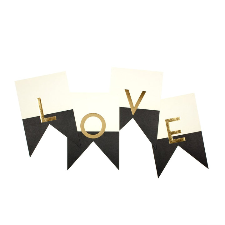 A decorative letter banner with the word &