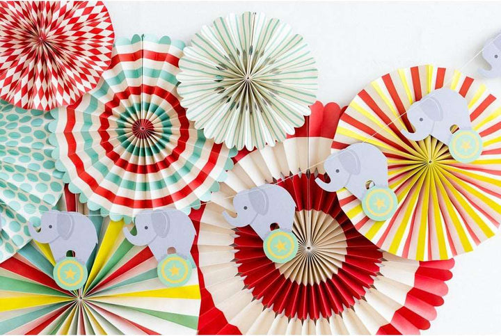 Elephant Die Cut Banner in front of a set of multicolor party fans